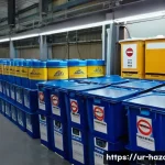 Home 21 위험물관리사 초보자를 위한 실무 가이드 - A well-organized industrial storage room in Pakistan, featuring clearly labeled containers of flamma...